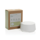 Enceinte à bruit blanc blanche présentée à côté de sa boîte en carton imprimée, avec panneau de commandes circulaire visible sur Enceinte à bruit blanc blanche présentée à côté de sa boîte en carton imprimée, avec panneau de commandes circulaire visible sur