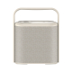 Vue de face d’une enceinte portable beige au format rectangulaire, avec façade recouverte de tissu, commandes sur le dessus et g Vue de face d’une enceinte portable beige au format rectangulaire, avec façade recouverte de tissu, commandes sur le dessus et g