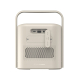 Vue arrière d’une enceinte portable beige avec poignée intégrée, grille perforée et connectiques regroupées sous un cache, compr Vue arrière d’une enceinte portable beige avec poignée intégrée, grille perforée et connectiques regroupées sous un cache, compr