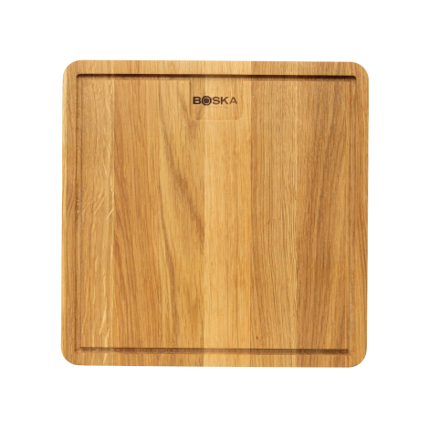 Planche à découper carrée en bois vue de dessus, avec angles arrondis, rainure périphérique et petite encoche rectangulaire sur 