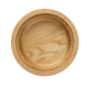 Support rond en bois vu de dessus, avec partie centrale creusée et rebord périphérique. Support rond en bois vu de dessus, avec partie centrale creusée et rebord périphérique.