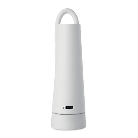 Face arrière de la lampe repliée, montrant la boucle formée par le bras flexible ainsi qu’un port de recharge et un petit témoin