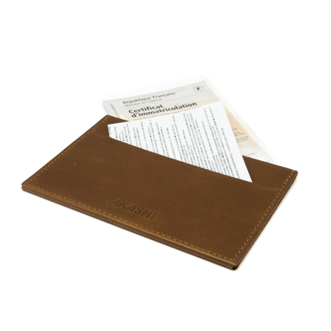 Étui contenant carte grise et documents.