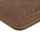 Cuir marron, coutures et personnalisation. Cuir marron, coutures et personnalisation.