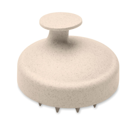 Brosse de massage beige mouchetée vue de profil, avec poignée courte sur le dessus et pointes des picots visibles sous la base.