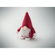 Lutin décoratif rouge présenté assis en perspective, avec bonnet pointu abaissé sur le visage, nez beige, barbe blanche et petit