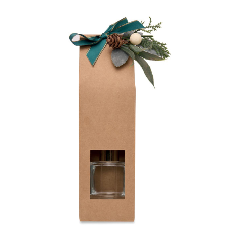 Vue de face de la boîte cadeau kraft décorée d’un ruban vert et de feuillage, avec fenêtre découpée laissant voir le flacon en v