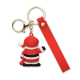 Vue de dos du porte-clés avec pendentif Père Noël rouge, blanc et noir, grand anneau, mousqueton doré et longue sangle rouge. Vue de dos du porte-clés avec pendentif Père Noël rouge, blanc et noir, grand anneau, mousqueton doré et longue sangle rouge.