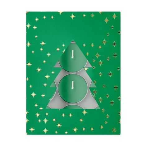 Vue de dessus d’une boîte cadeau verte parsemée d’étoiles dorées, avec découpe en forme de sapin laissant apparaître plusieurs b