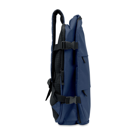 Vue de profil d’un sac à dos cabine bleu en configuration compacte, avec deux sangles de compression latérales à boucles et dos 