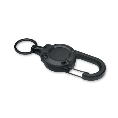 Vue de trois quarts d’un porte-badge rétractable noir, montrant son boîtier rond avec vis apparentes, son mousqueton à fermeture