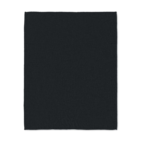 Vue de dessus de la couverture noire entièrement dépliée, de forme rectangulaire, avec une surface textile uniforme.