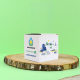 Boîte cubique en papier ensemencé personnalisée avec le logo Paudes Énergies et des illustrations colorées, posée sur une rondel Boîte cubique en papier ensemencé personnalisée avec le logo Paudes Énergies et des illustrations colorées, posée sur une rondel