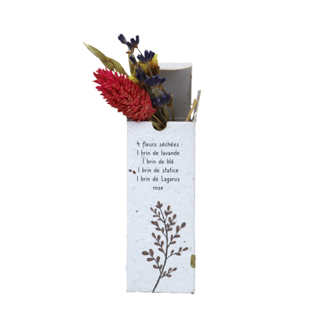 Coffret publicitaire en papier ensemencé personnalisé Institut Perle Noire, ouvert et garni d'un petit bouquet de fleurs séchées