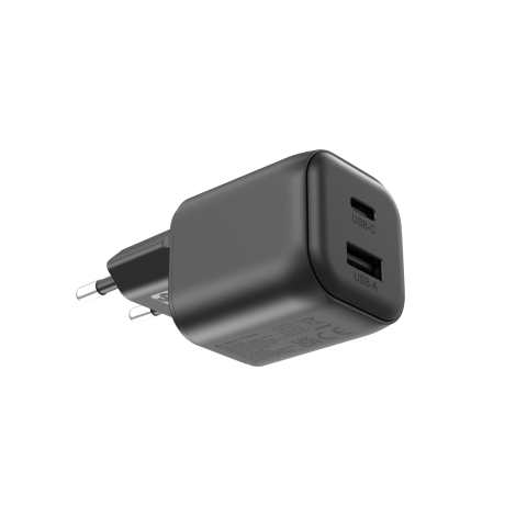 Vue en contre-plongée du chargeur noir mettant en évidence ses deux ports USB-C et USB-A sur la face avant, ses broches rondes à
