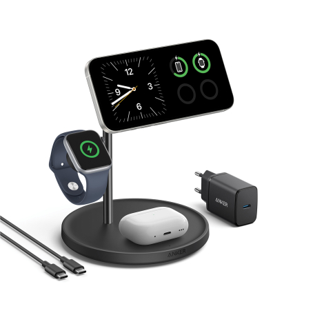 Station de recharge noire avec smartphone placé à l'horizontale affichant une horloge et des indicateurs de charge, montre conne